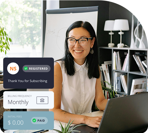An asian woman smiling at work desk