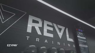A wall displays the Revl Training logo, highlighting the brand's commitment to athletic training and development. Below it sits the Ezypay logo in white.
