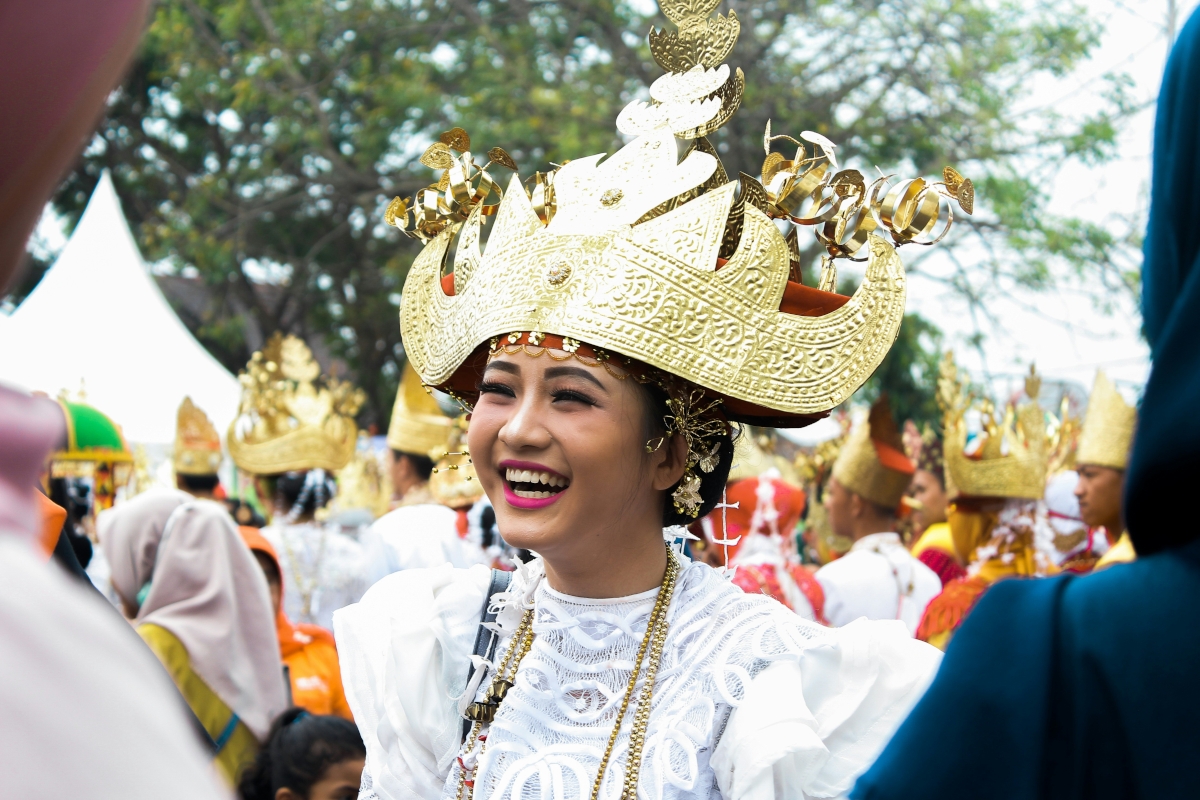 Thai lady smiling wearing traditional outfit 