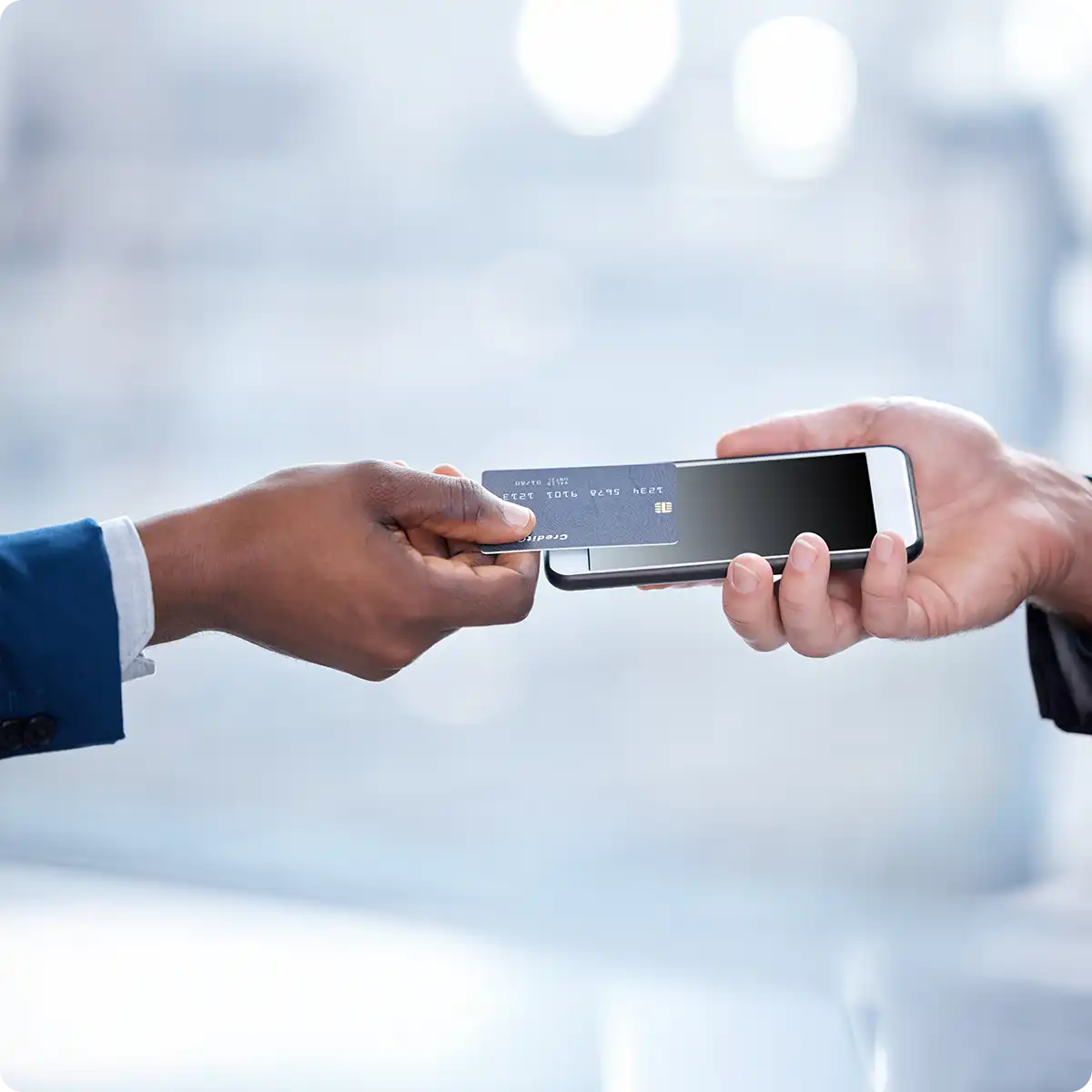 Tap to pay, a business man pays with credit card on phone terminal