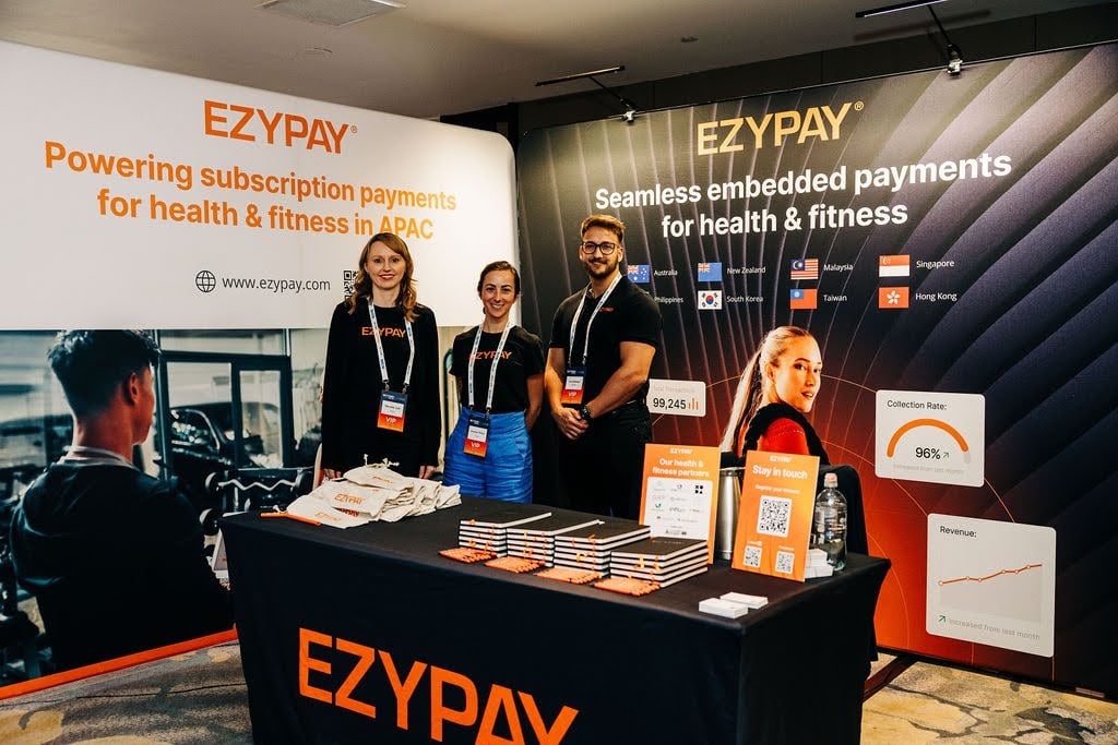Team of experts at the Ezypay booth at Beyond Activ World, ready to discuss subscription payments for health and fitness.